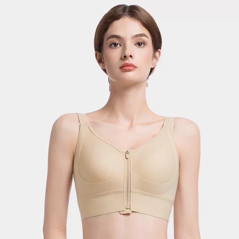 Beige post-surgery front-zip full-coverage compression bra vest on model