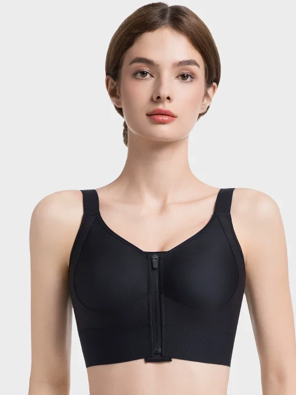 Black post-surgery front-zip full-coverage compression bra vest on model
