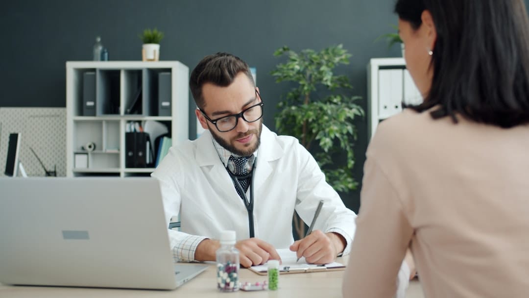 Healthcare provider speaking with a patient about recovery guidance