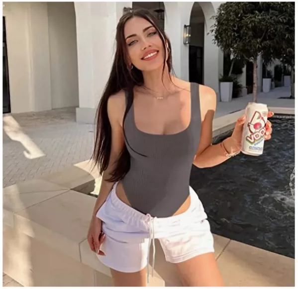 Gray scoop-neck ribbed bodysuit styled with white casual shorts