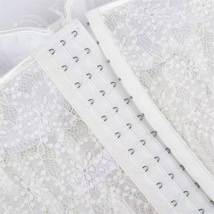 Hook-and-eye closure detail on the white lace bustier corset top