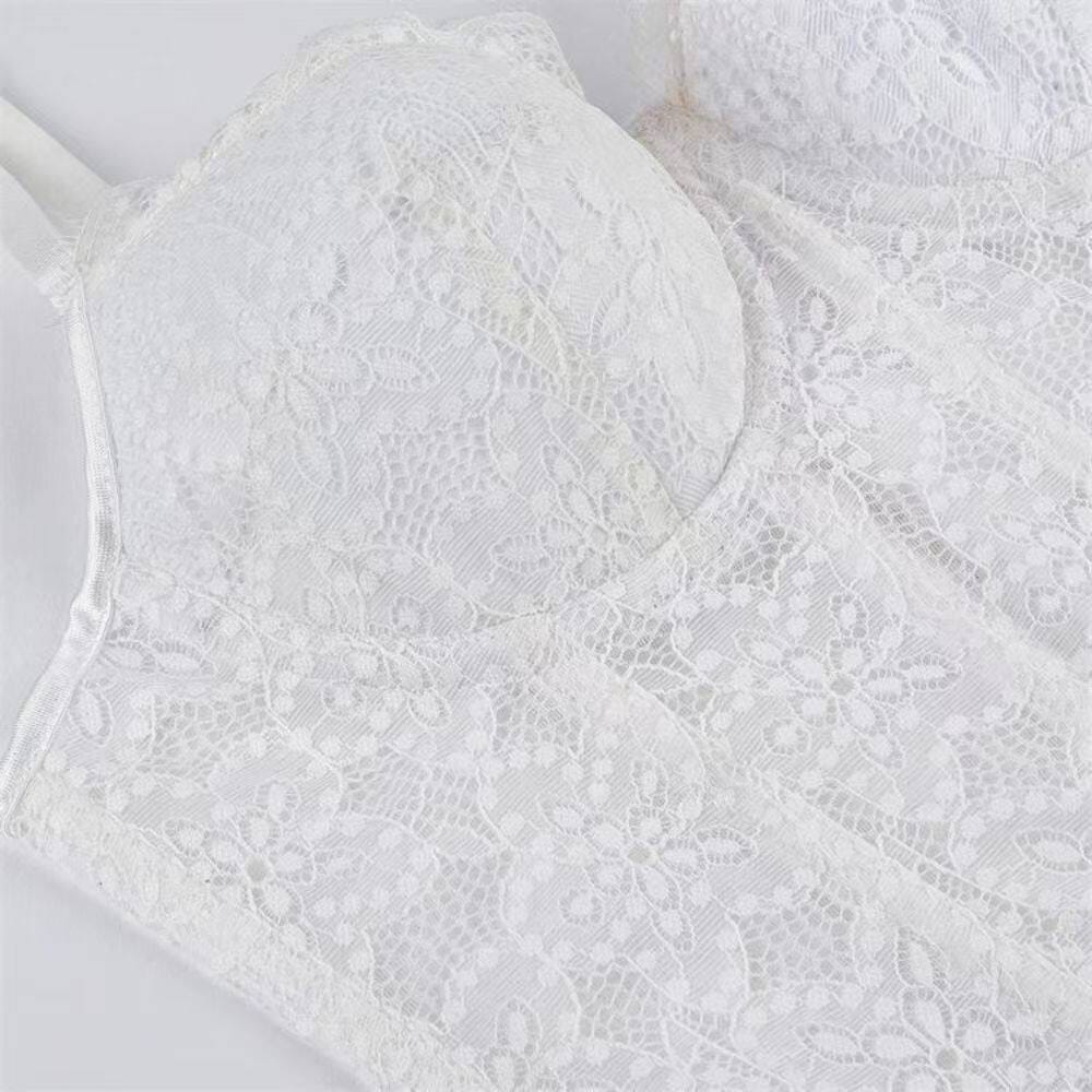 Close-up of the floral lace and structured seams on the white bustier corset top