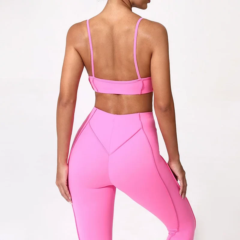Qinelle sports bra and high-waist leggings set in bright pink back view