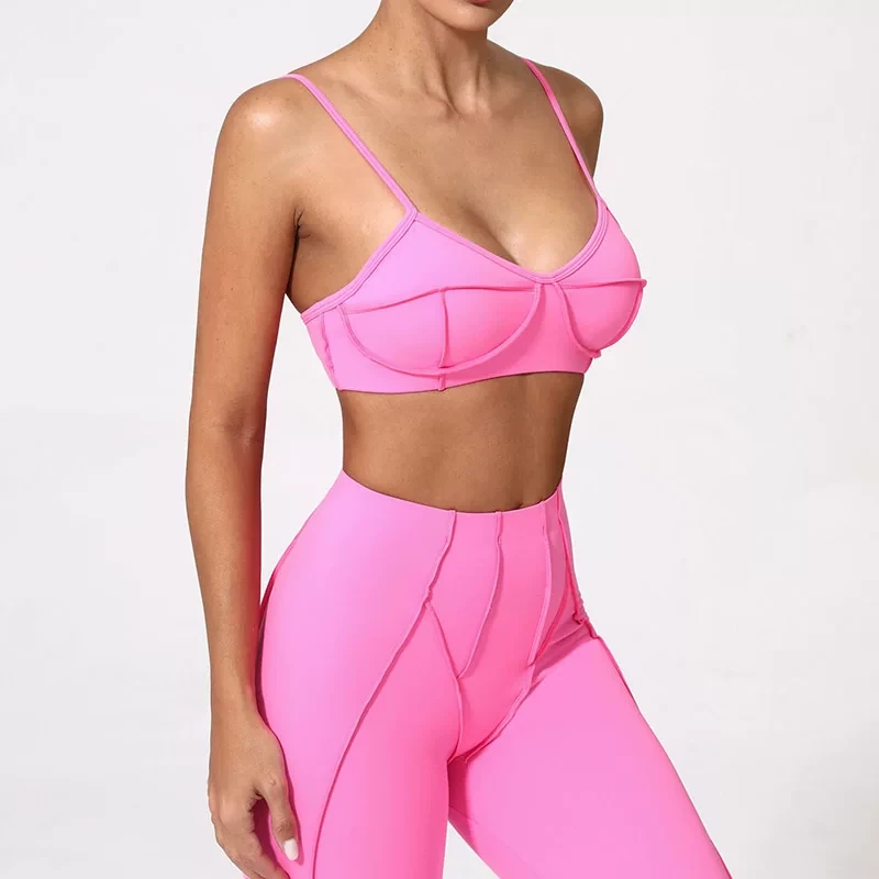 Qinelle sports bra and high-waist leggings set in bright pink front angle