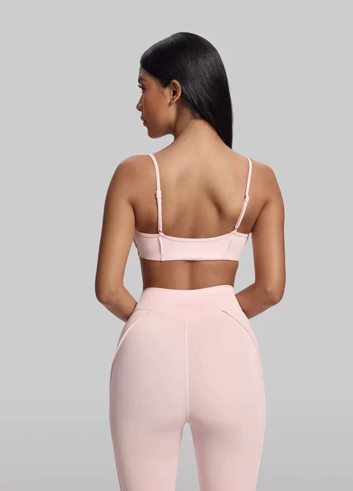 Qinelle sports bra and high-waist leggings set in pink back view