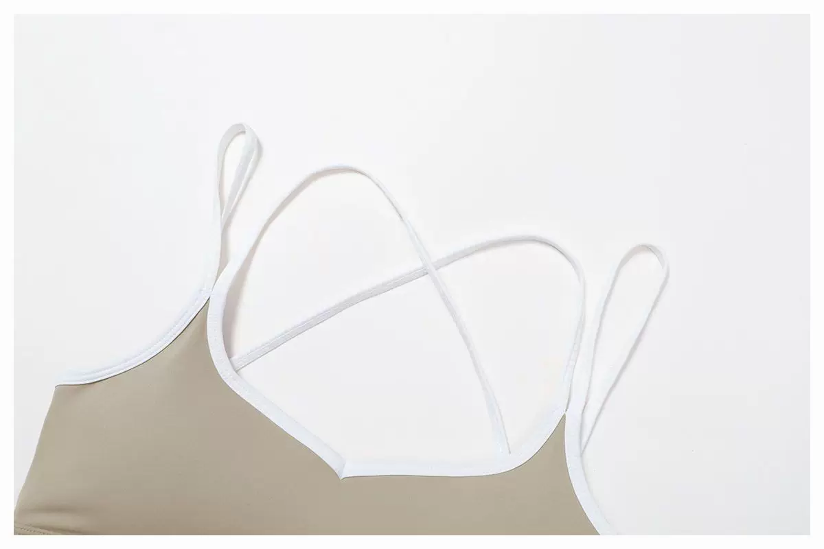 Khaki sports bra cross-back strap construction detail