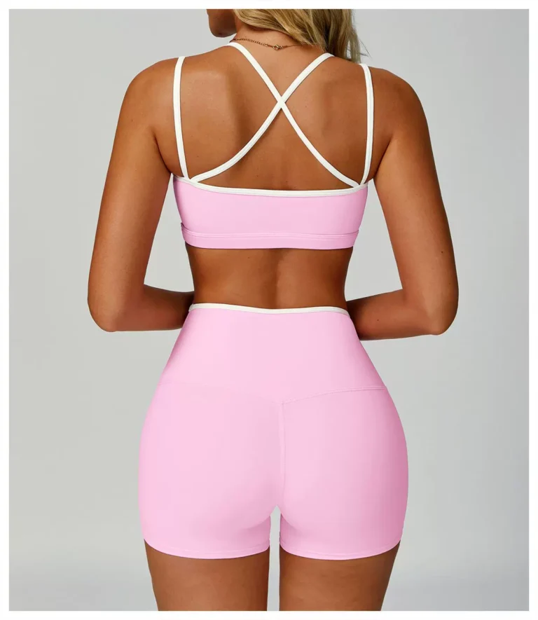 Pink cross-back sports bra and high-waist shorts set, back view