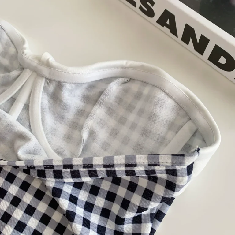 Interior cup and neckline construction of gingham corset bustier top