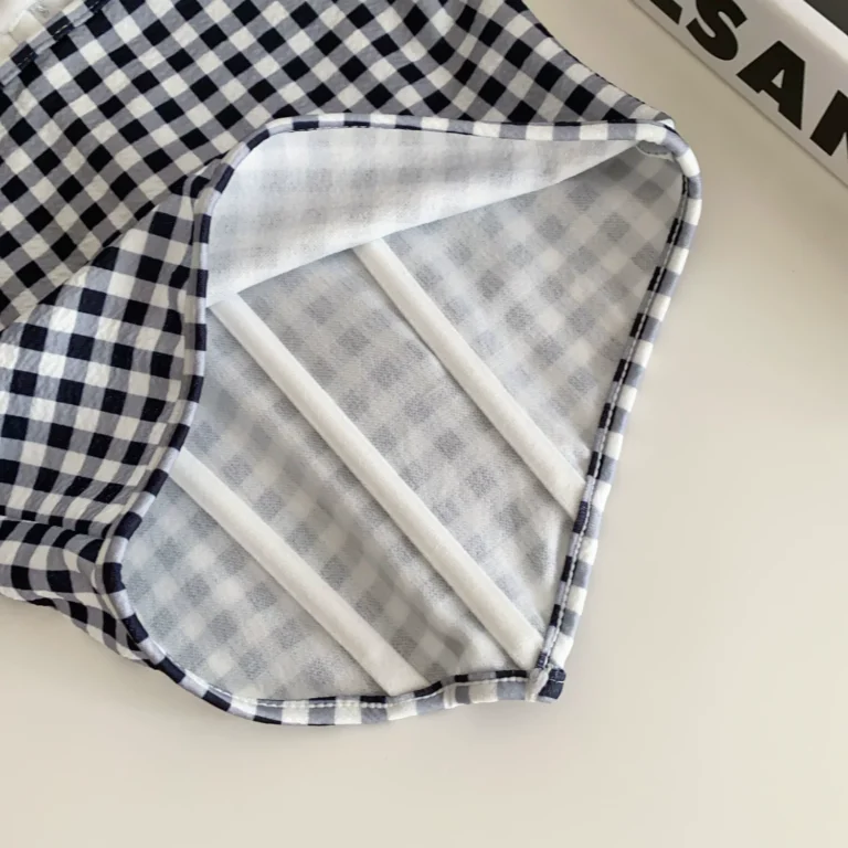 Interior vertical support channels of gingham corset bustier top