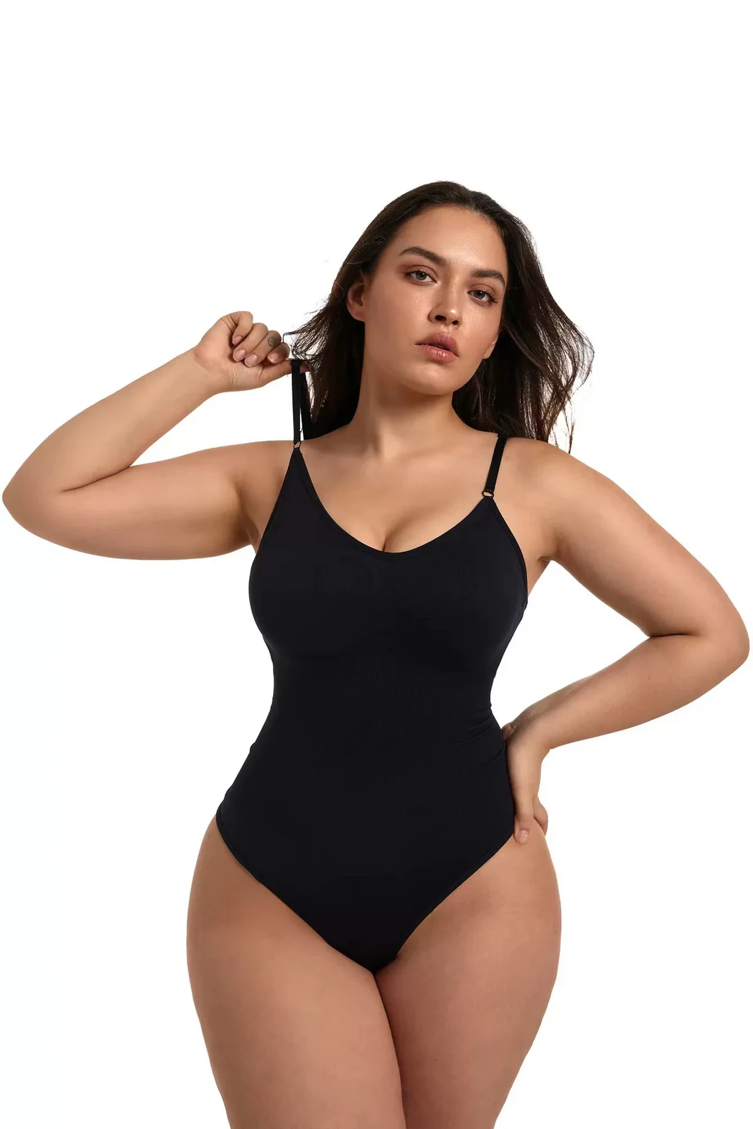 Black seamless shaping bodysuit on a curvy model