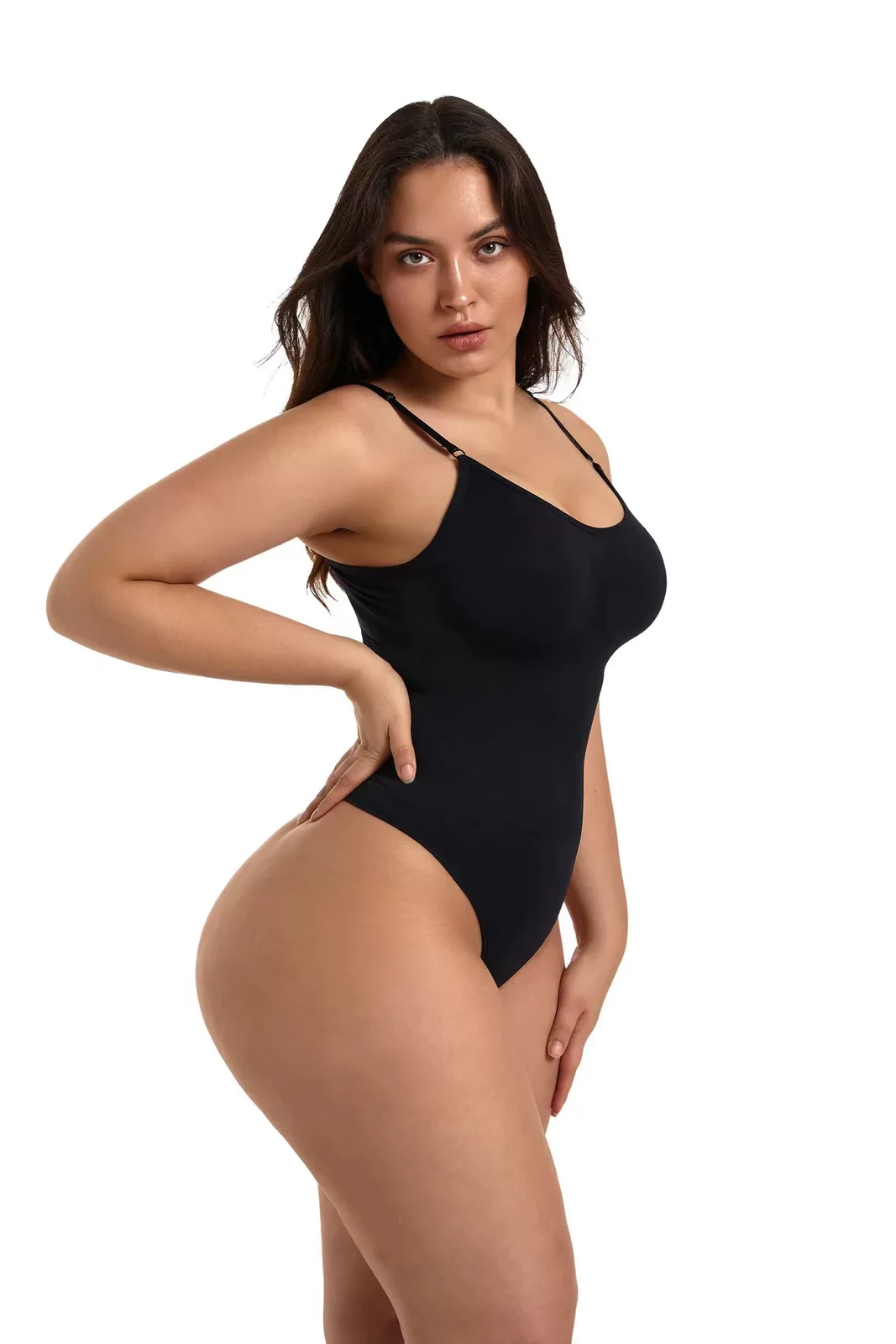 Black seamless bodysuit showing close torso fit from the side