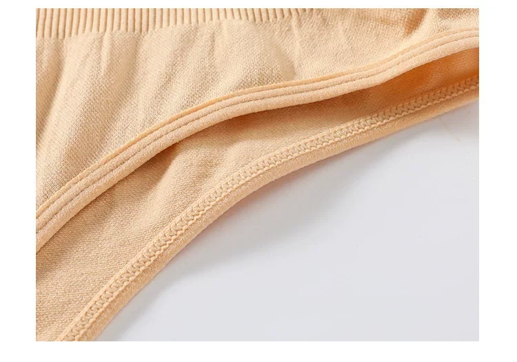 Close view of the nude bodysuit edge and stitching