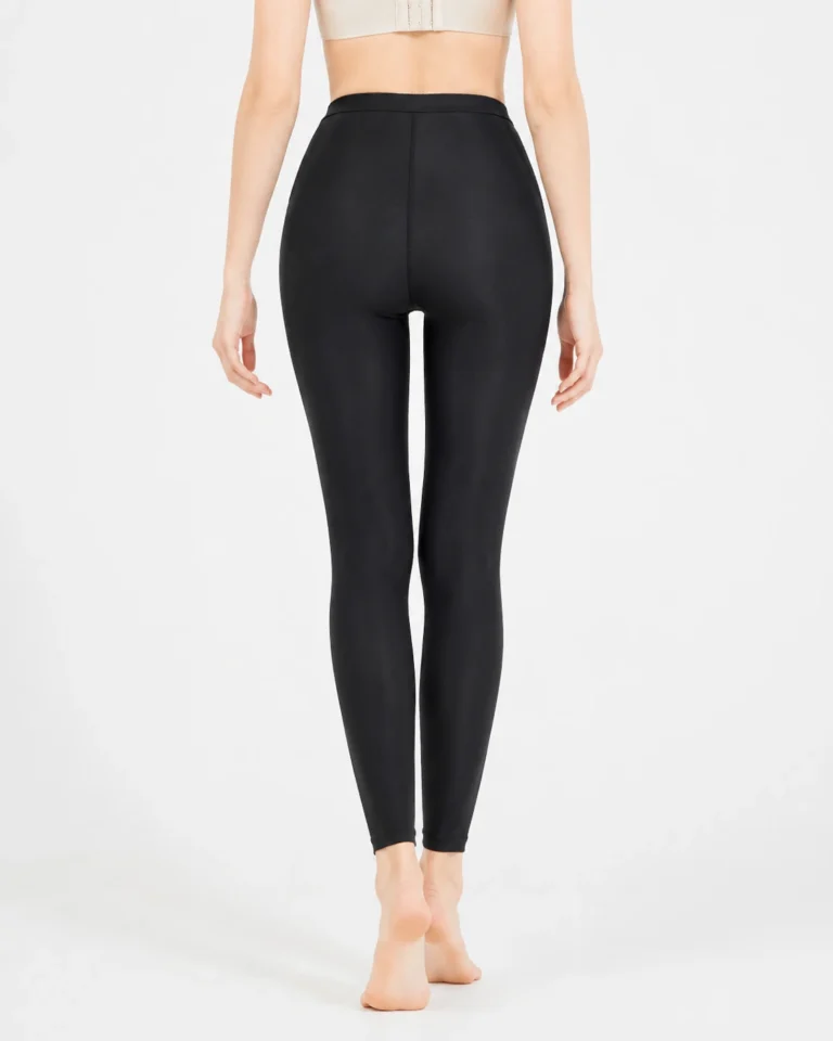 Black high-waist full-length compression leggings back view with shaped rear seams