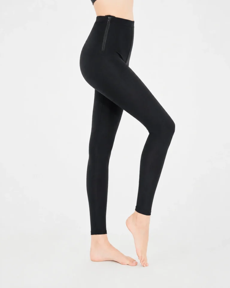 Black high-waist post-surgery compression leggings side view with side zipper