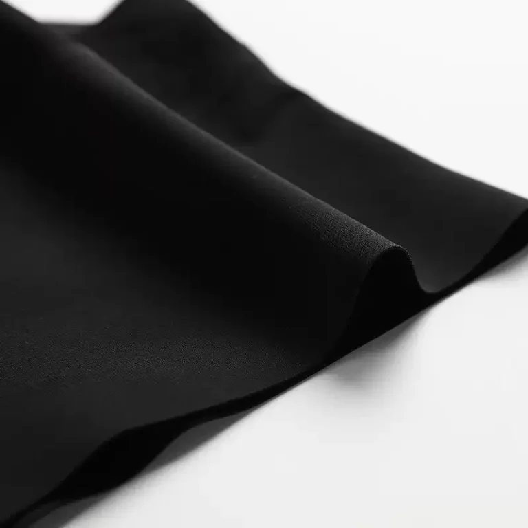 Smooth black stretch fabric close-up