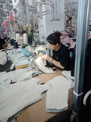 Skilled seamstress hand-stitching shapewear