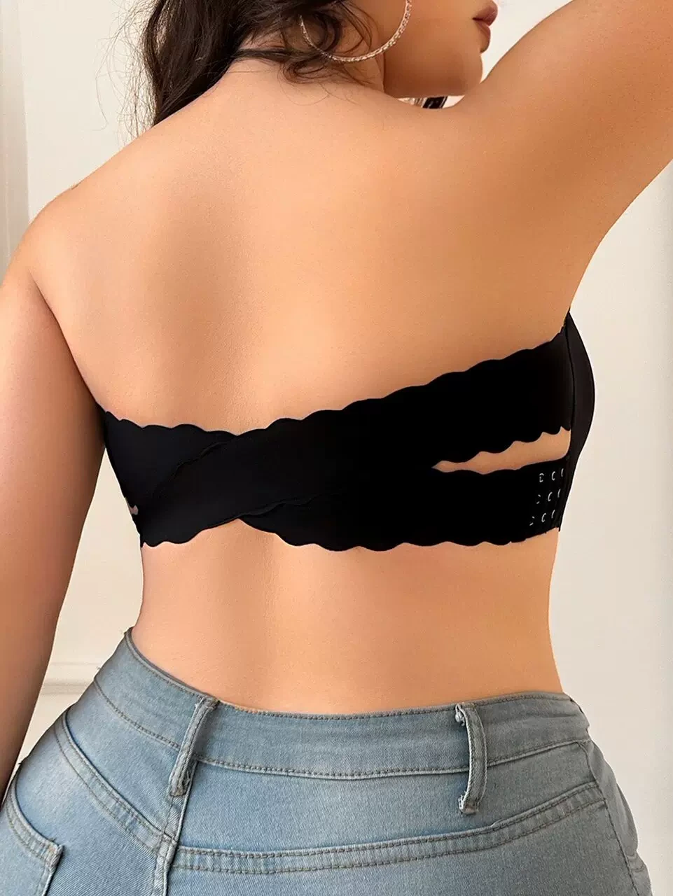 Qinelle black strapless bra crossed back bands and side hook close-up