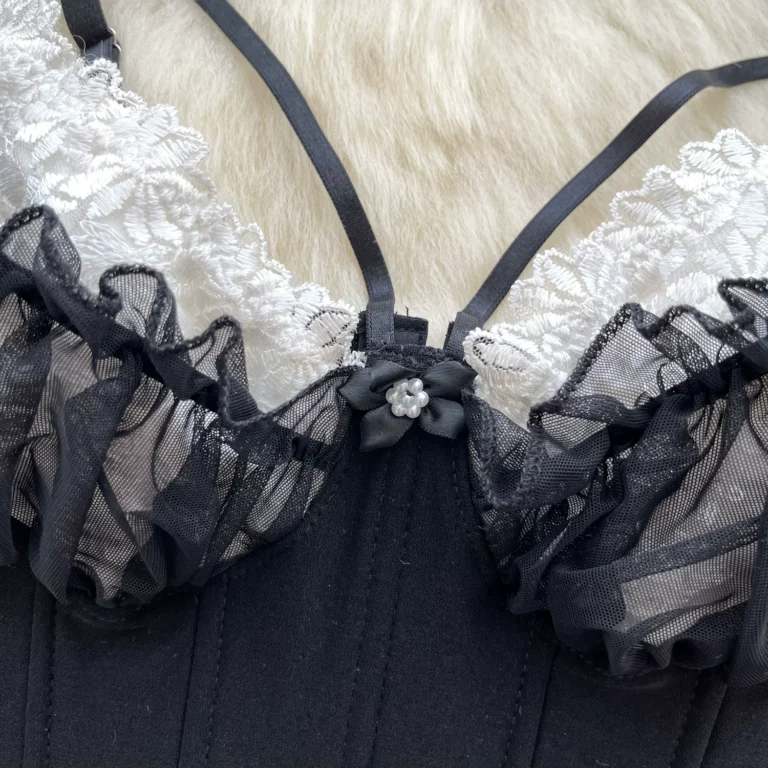 Black and white lace corset cami cup detail with ruffle trim, double straps and pearl flower accent