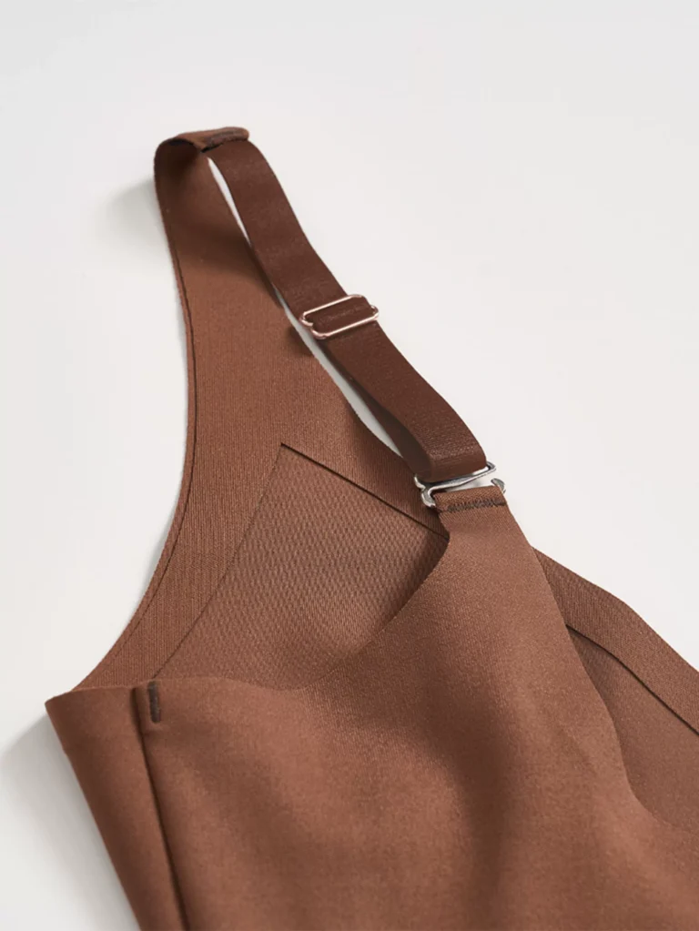 Brown seamless V-neck bodysuit back panel and adjustable shoulder strap detail