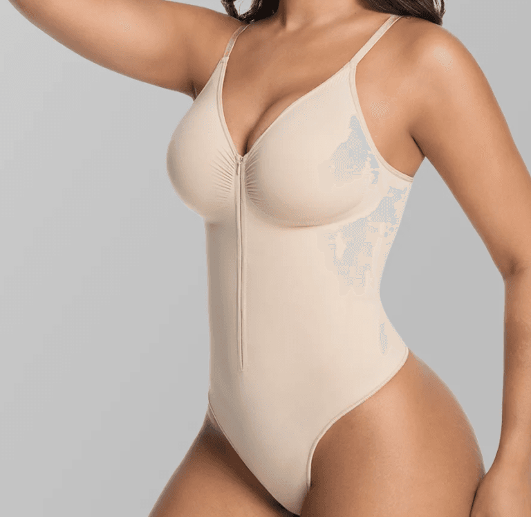 Close view of the Nude adjustable-strap zip-front bodysuit showing shaped bust panels