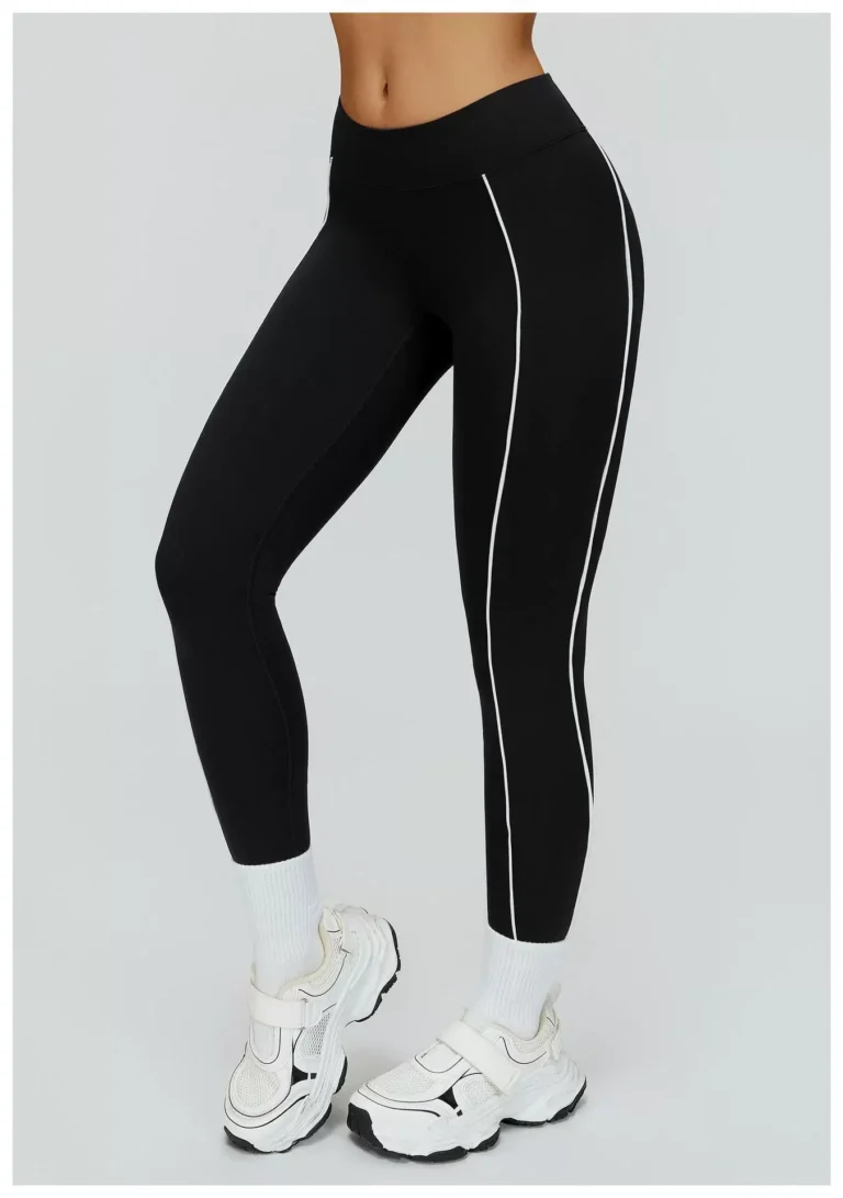 Black high-waist contrast-piping leggings in a front angled view
