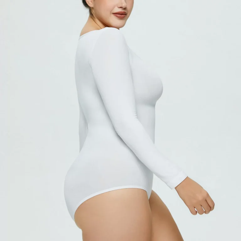 White long-sleeve scoop-neck bodysuit side view showing smooth torso fit