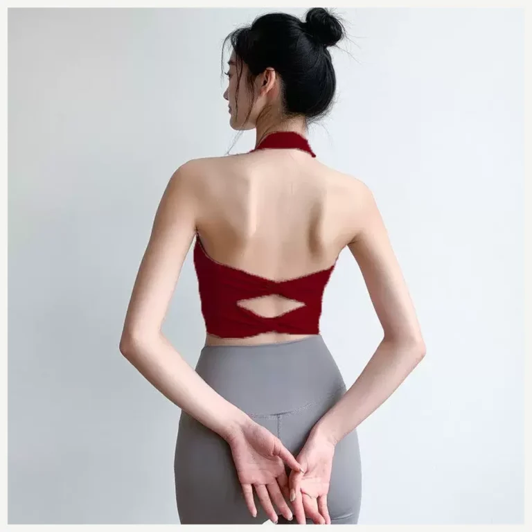 Burgundy open-back halter sports crop top studio view