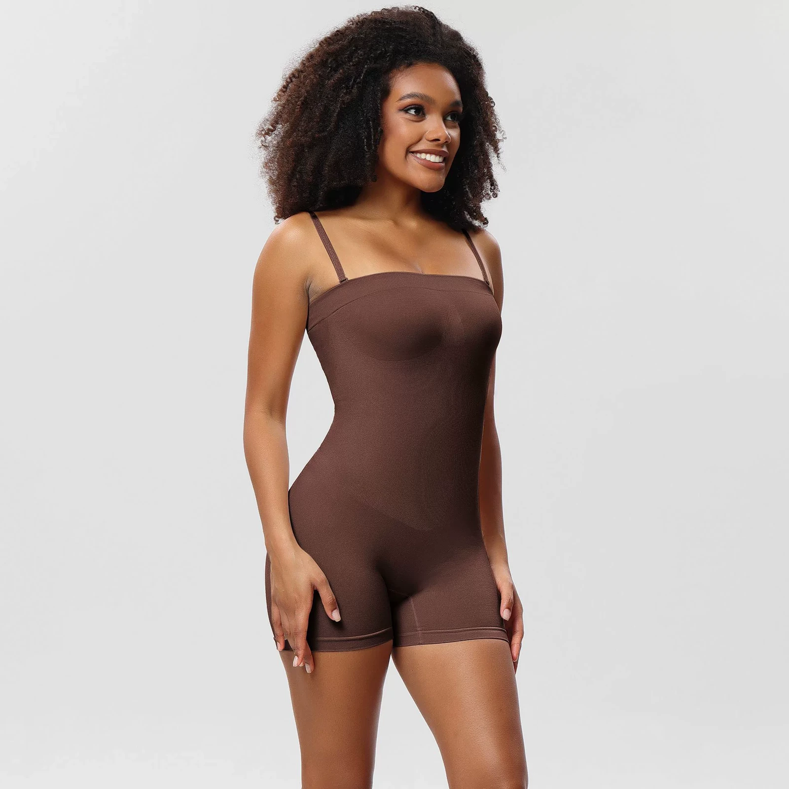 Brown seamless convertible-strap shaping bodysuit with shorts worn with adjustable straps