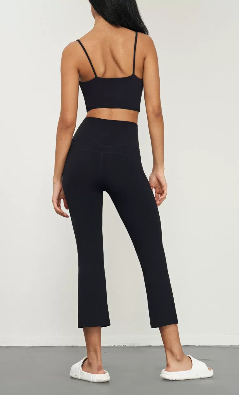 Qinelle high-waist cropped flare yoga pants in Black — back view