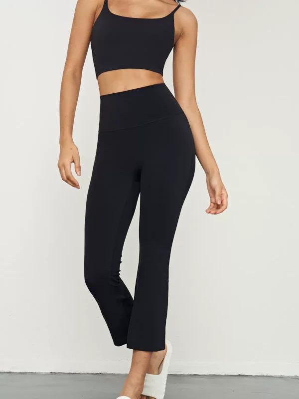 Qinelle high-waist cropped flare yoga pants in Black — front view