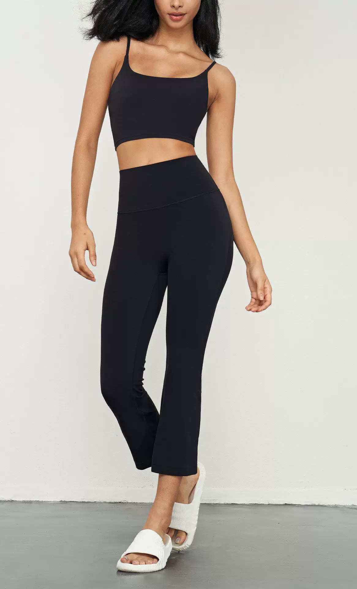Qinelle high-waist cropped flare yoga pants in Black — front view
