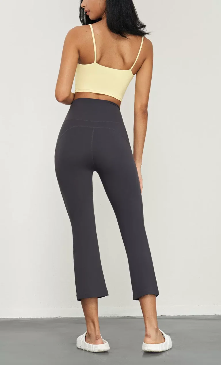 Qinelle high-waist cropped flare yoga pants in Graphite Gray — back view
