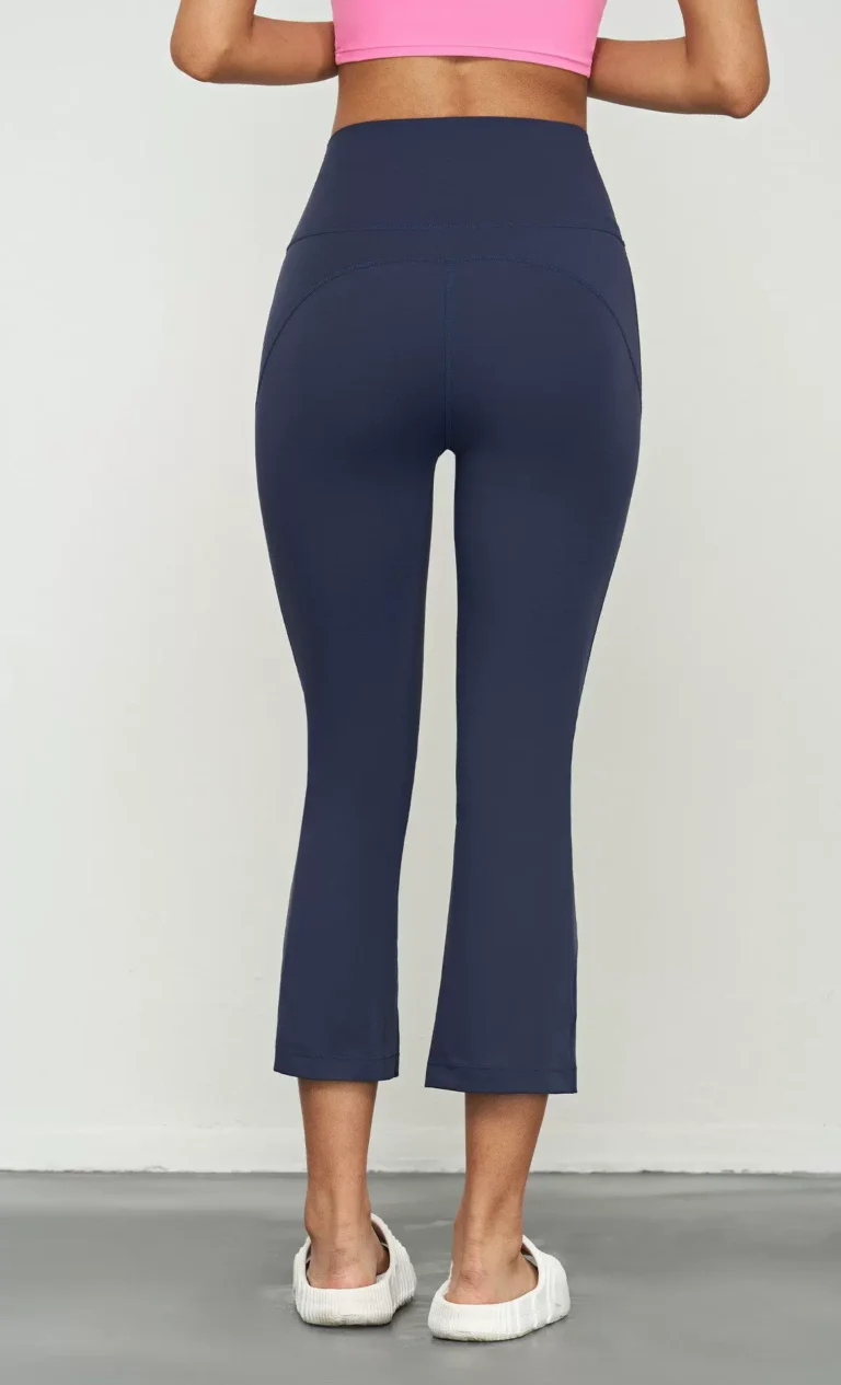 Qinelle high-waist cropped flare yoga pants in Navy Blue — back view