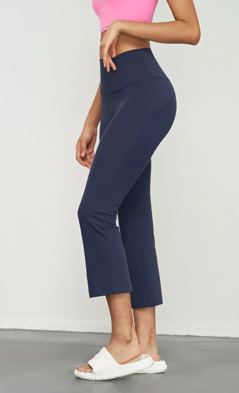 Qinelle high-waist cropped flare yoga pants in Navy Blue — side view