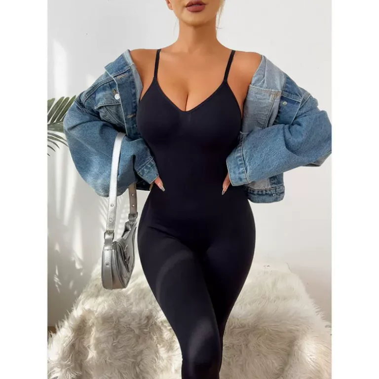 Qinelle black ankle-length shaping jumpsuit styled with a denim jacket