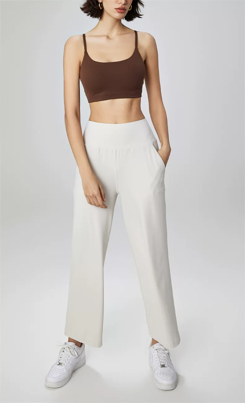 Khaki scoop-front sports bra crop top styled with relaxed trousers