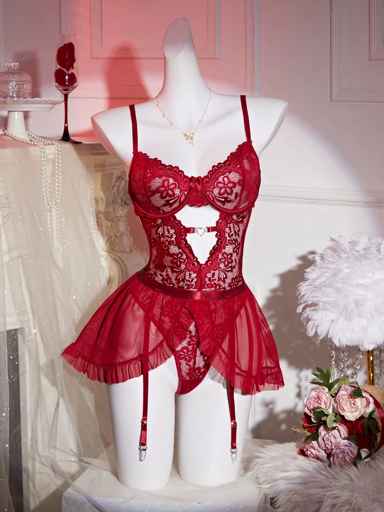 Front view of wine red underwire lace bustier with separate thong and garter skirt