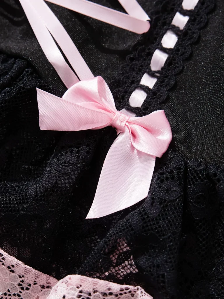 Qinelle black lace and pink bow close-up detail