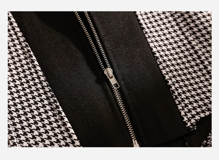 Center-back metal zipper detail of Qinelle houndstooth corset bustier top