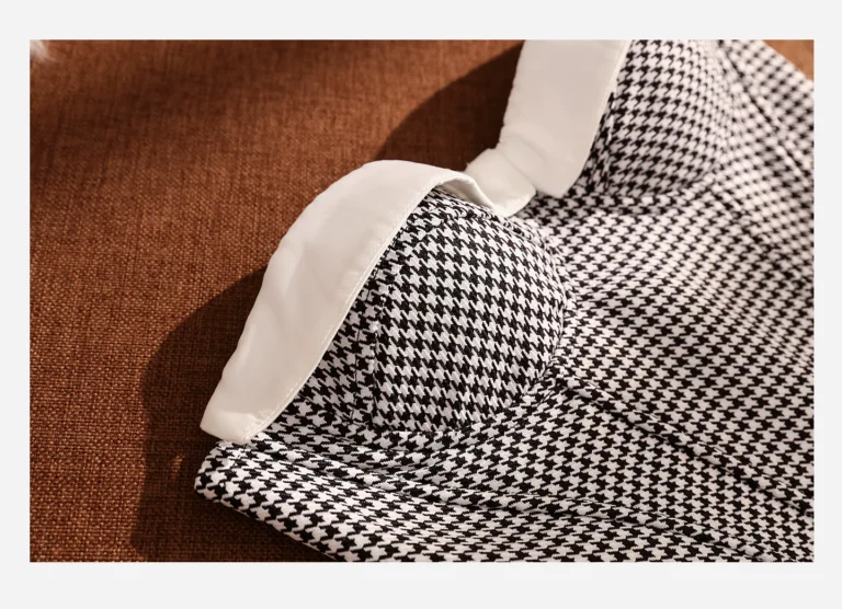 White contrast fold-over neckline and molded cup detail of Qinelle houndstooth bustier
