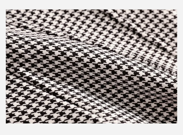 Close-up of Qinelle black-and-white houndstooth woven fabric