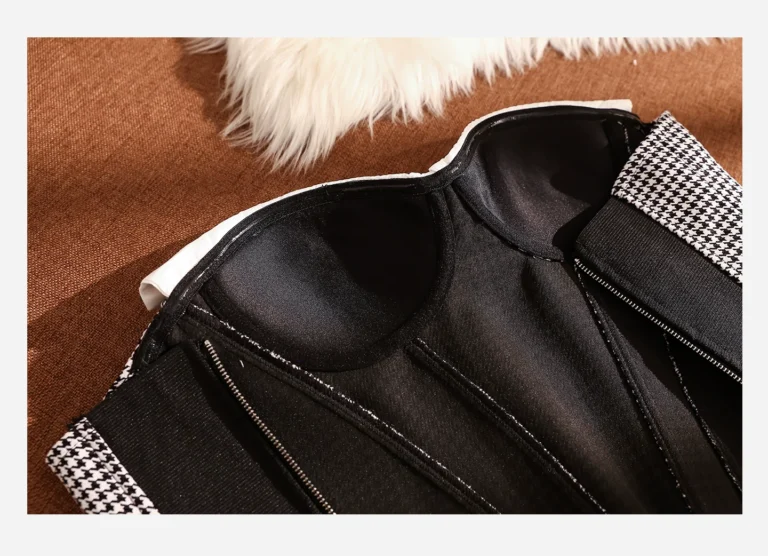 Interior molded cups, black lining and vertical support channels of Qinelle houndstooth bustier