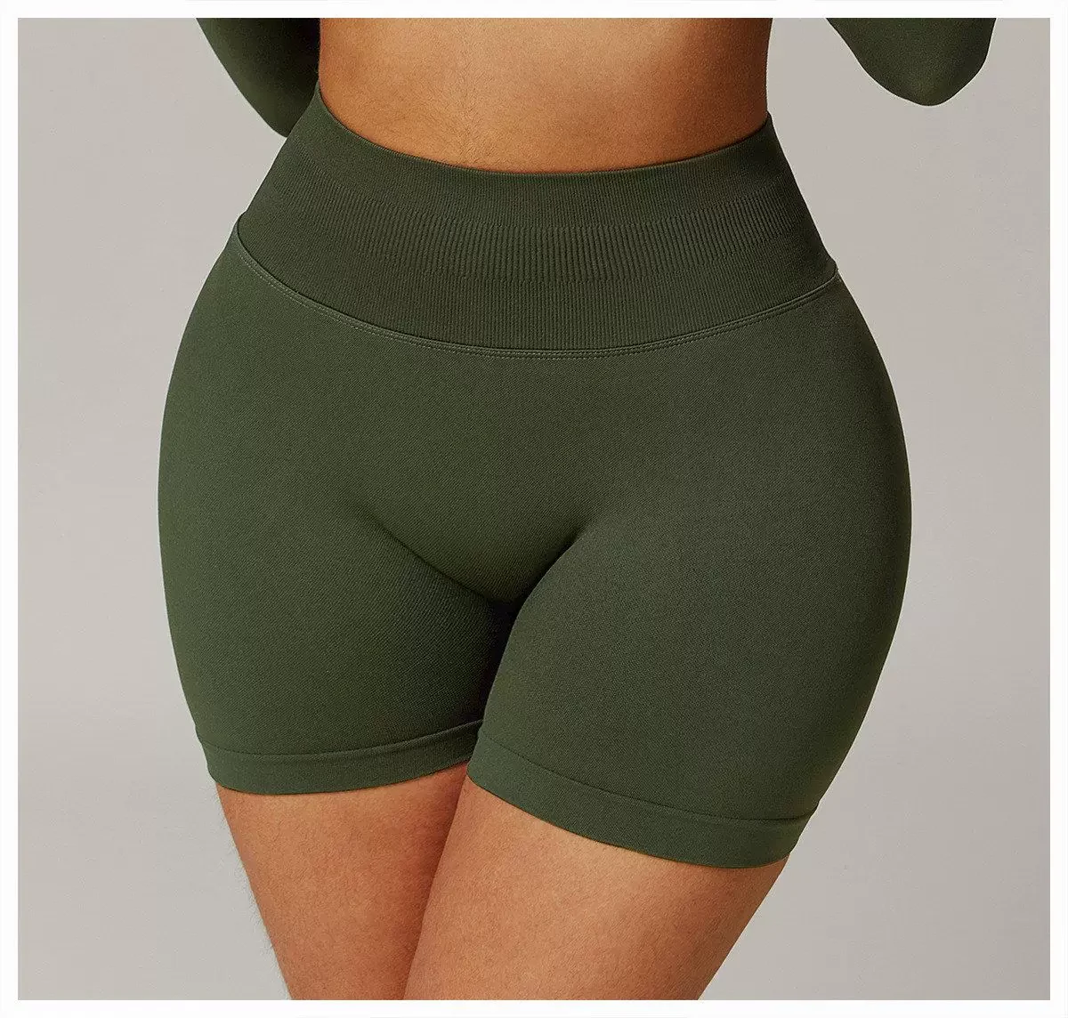 Forest green seamless biker shorts front waist and thigh detail