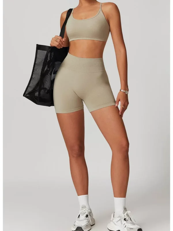 High-waist seamless scrunch-back biker shorts in a neutral oat beige tone, full front view