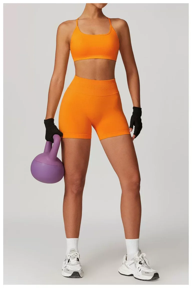 Tangerine seamless biker shorts styled for a strength workout
