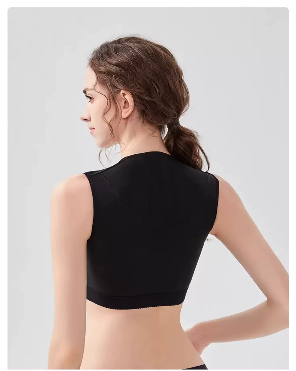 Black open-bust post-surgery support vest back view