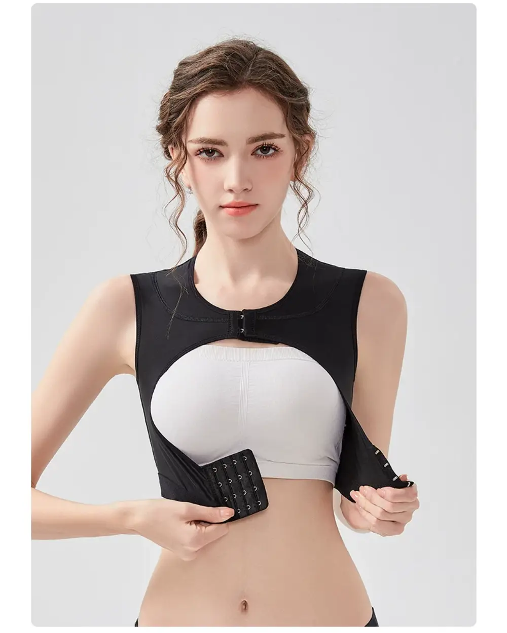 Black recovery vest showing separate front hook closures