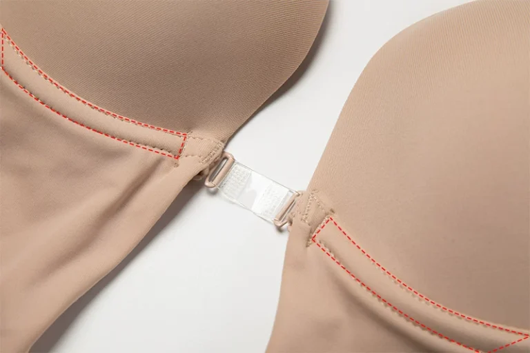 Nude deep-plunge bodysuit clear center-front connector detail