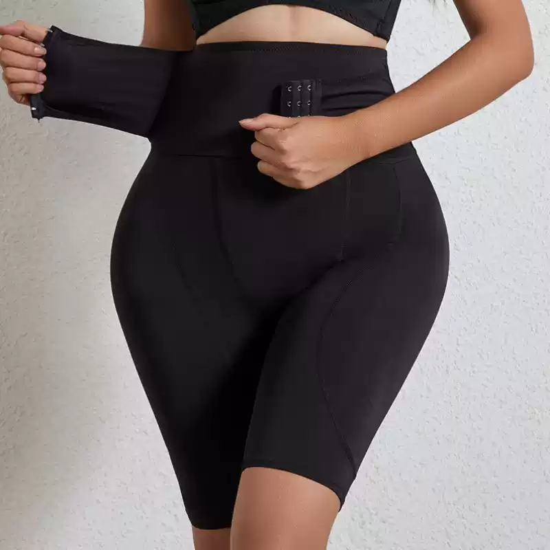Black shaper shorts showing the adjustable wraparound waist panel