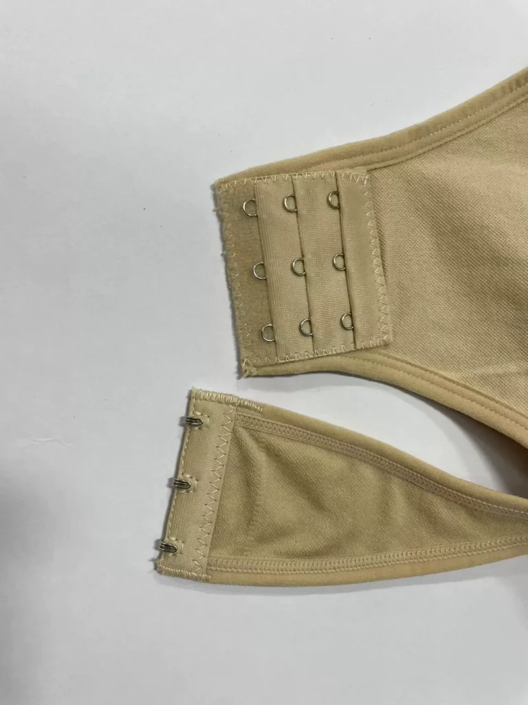 Three-position hook-and-eye crotch closure detail
